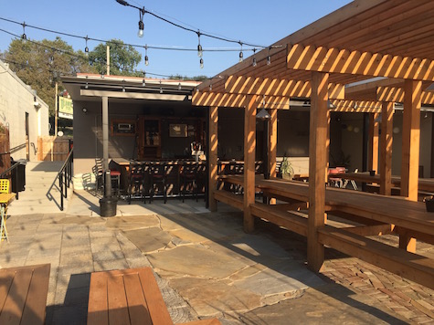 O'Leaver's new patio / beer garden, looking from the back benches toward the new bar and patio entrance. The door from inside O'Leaver's that leads to the patio is on the far left.