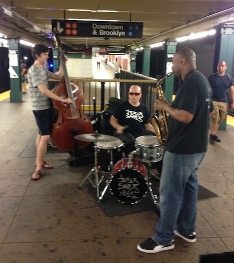 A jazz trio hustling for tips at the West 4th St. subway station in lower Manhattan. 